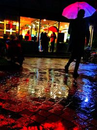 Blurred motion of people in city at night