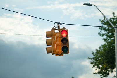 Low angle view of a street light  against sky