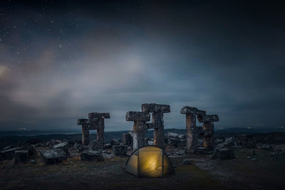 Abandoned built structure against sky at night