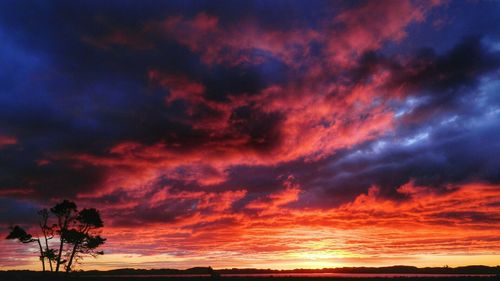 Low angle view of cloudy sky at sunset