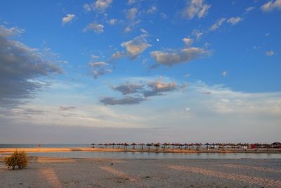 Scenic view of beach against sky during sunset
