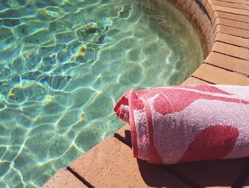 Low section of person standing in swimming pool