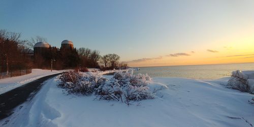 Scenic view of sea against clear sky during winter