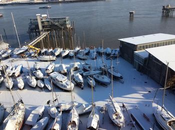 High angle view of fishing boats moored at harbor