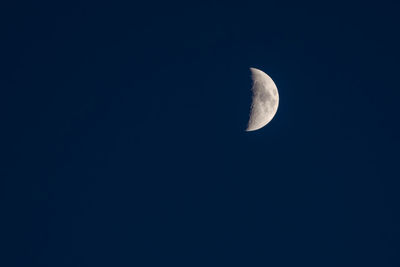 Low angle view of moon against clear sky at night
