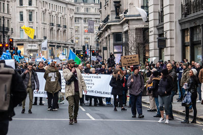 People walking on street in city