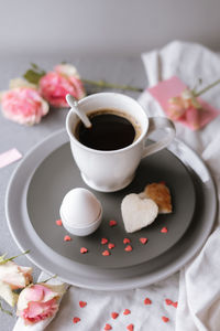 High angle view of coffee and cup on table