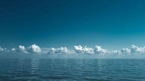 Scenic view of sea against blue sky