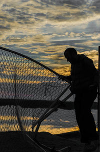 Silhouette of woman at sunset