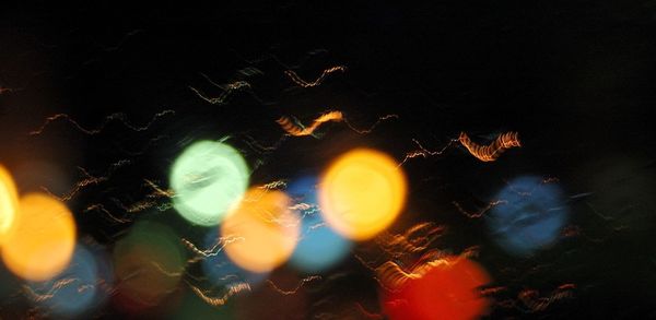 Close-up of illuminated lights at night