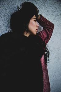 Portrait of beautiful young woman looking away