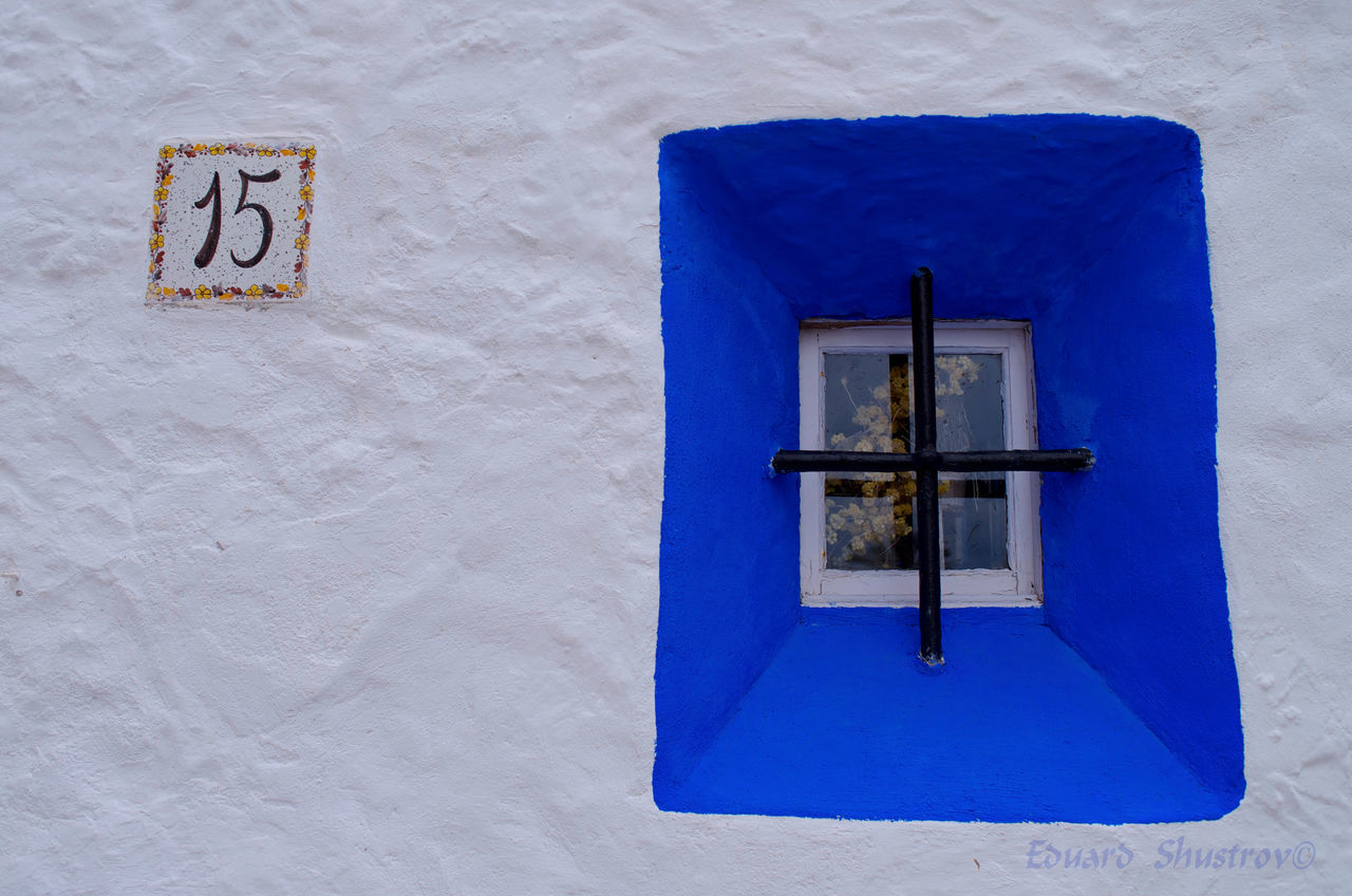 OPEN DOOR ON BUILDING WALL OF TEMPLE