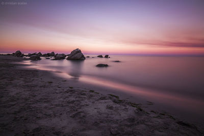 Scenic view of sea at sunset