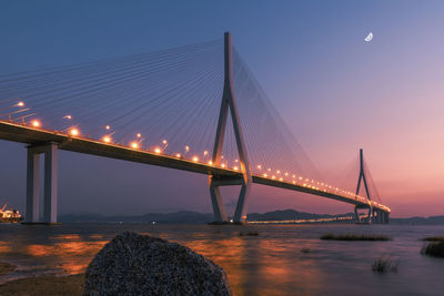 View of suspension bridge at night