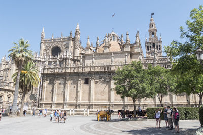 People in front of historic building