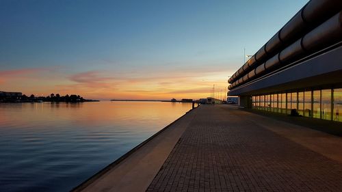 View of calm river at sunset