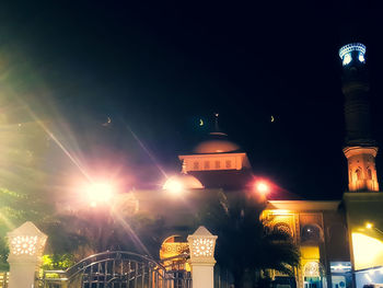 Low angle view of illuminated building at night