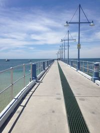 Pier over sea against sky