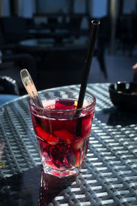 Close-up of red drink on table