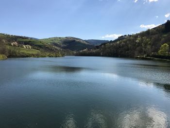 Scenic view of lake against blue sky