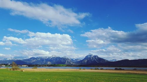 Scenic view of mountains against cloudy sky