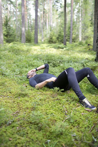 Tired runner in forest