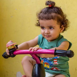 Cute little boy shivaay driving cycle at home balcony during summer time, sweet little boy