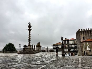 View of buildings against cloudy sky