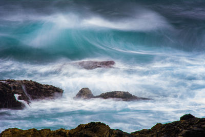 Scenic view of sea against cloudy sky