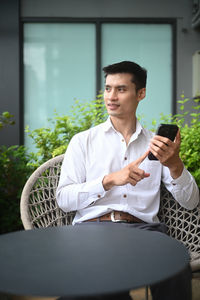 Young man using mobile phone