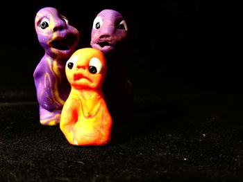 Close-up of stuffed toy against black background