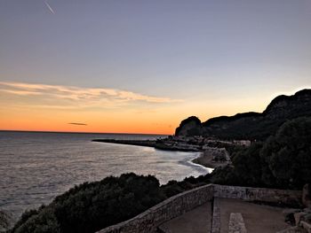 Scenic view of sea against clear sky during sunset