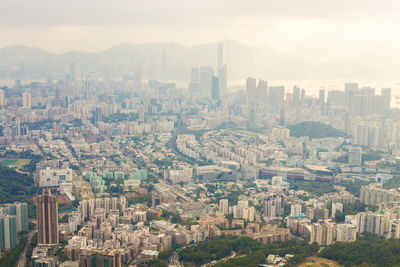 High angle view of buildings in city against sky