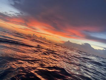 Scenic view of sea against orange sky