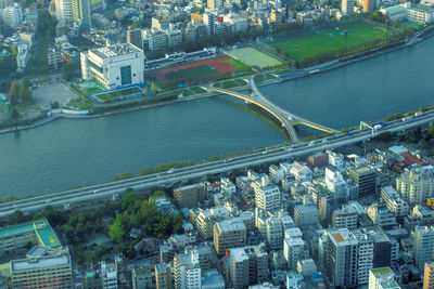 High angle view of river amidst buildings in town