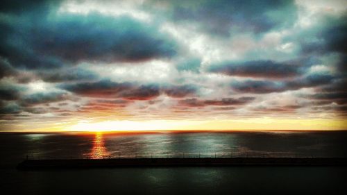 Dramatic sky over sea during sunset