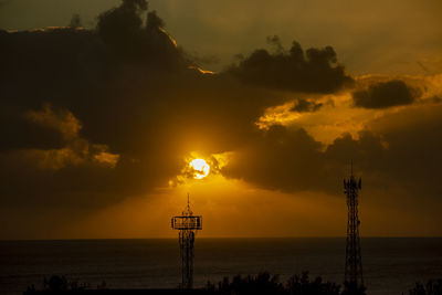 Sunset over the ocean in albion, mauritius.