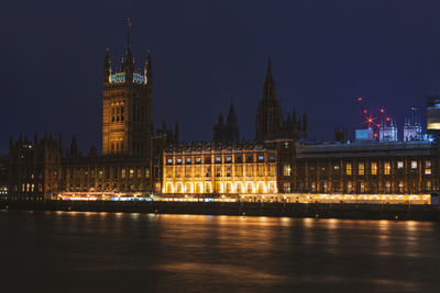 Illuminated buildings in city at night