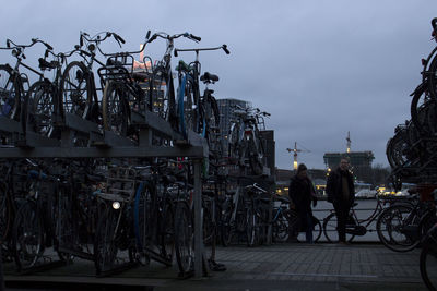 People on street in city against sky