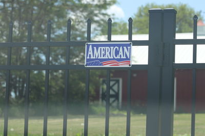 Close-up of flag against trees