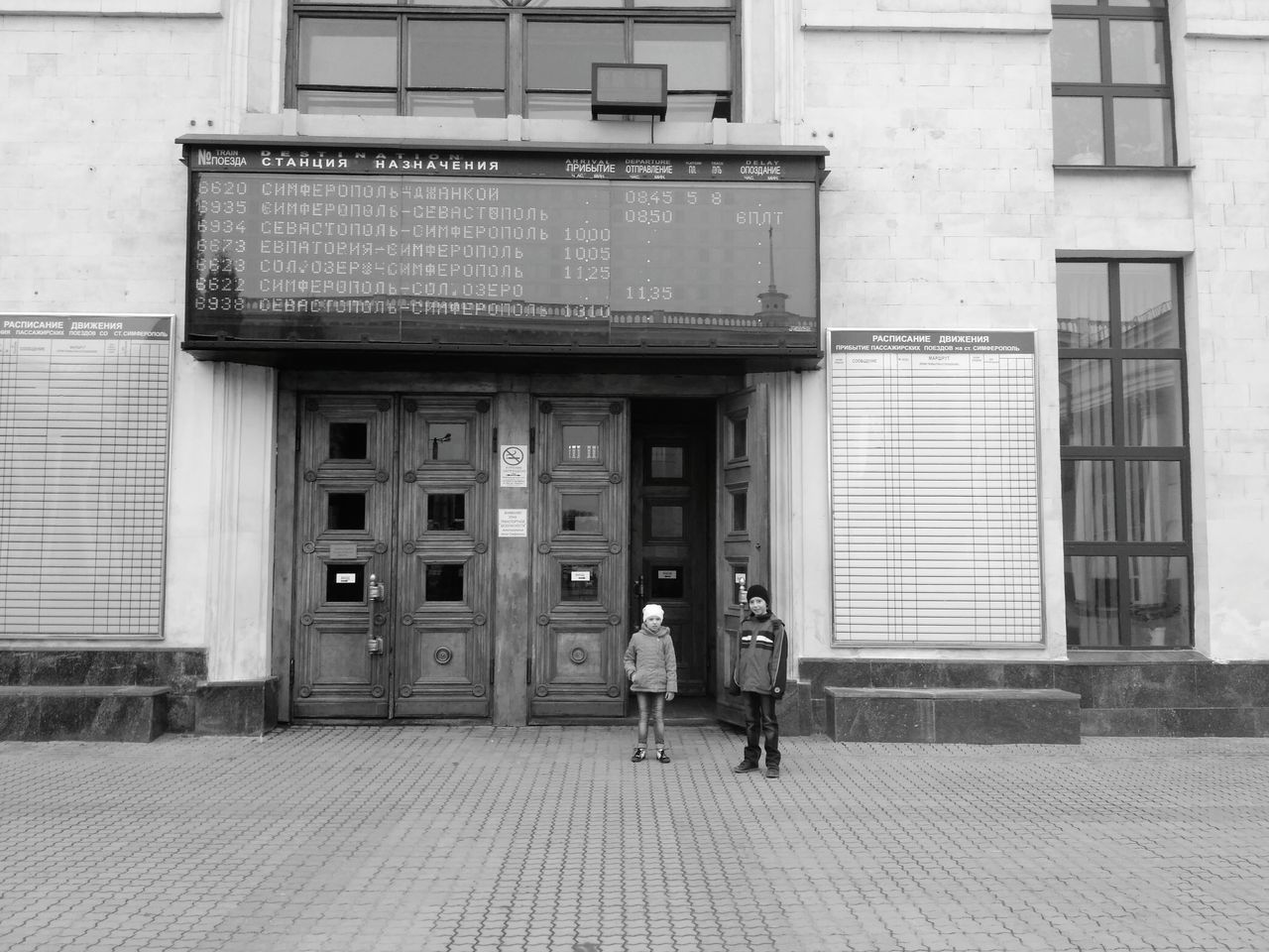 building exterior, architecture, built structure, closed, door, communication, outdoors, facade, city, men, adults only, one person, adult, technology, people, day, one man only, only men