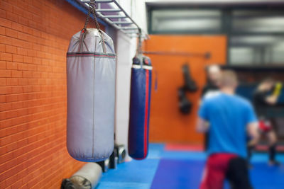 Punching bags hanging in boxing ring