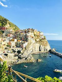 Townscape by sea against sky