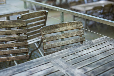 High angle view of wooden bench on table