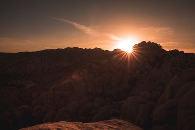 Scenic view of mountains against sky during sunset