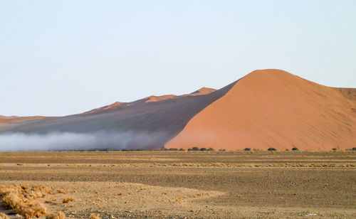 Scenic view of desert against clear sky