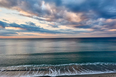 Scenic view of sea against sky during sunrise