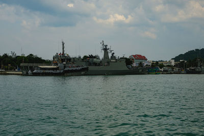 Boats in sea against sky