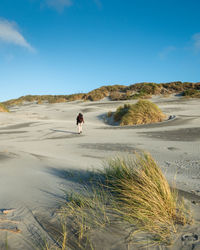 Man on beach against sky