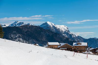 Winter magic. the ancient wooden houses of sauris di sopra. italy